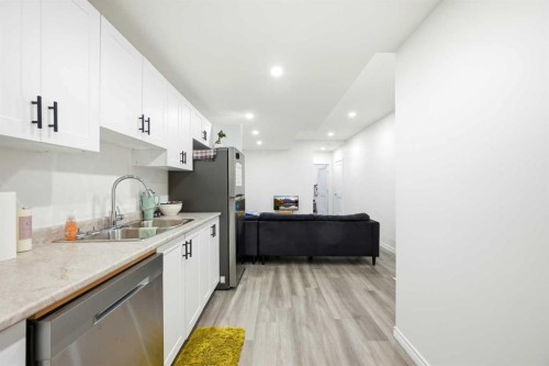 185 Edith Green Nw, Calgary, AB - Indoor Photo Showing Kitchen With Double Sink