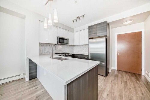 3210-95 Burma Star Road Sw, Calgary, AB - Indoor Photo Showing Kitchen With Stainless Steel Kitchen With Double Sink With Upgraded Kitchen