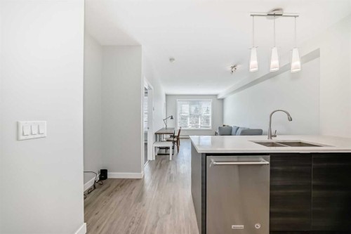3210-95 Burma Star Road Sw, Calgary, AB - Indoor Photo Showing Kitchen With Double Sink