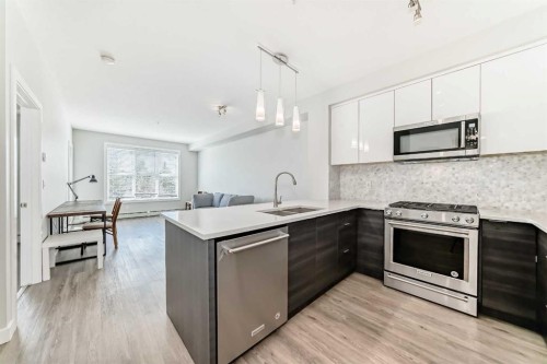 3210-95 Burma Star Road Sw, Calgary, AB - Indoor Photo Showing Kitchen With Double Sink With Upgraded Kitchen