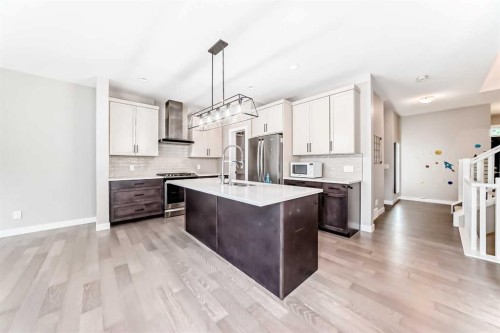41 Shawnee Green Sw, Calgary, AB - Indoor Photo Showing Kitchen With Stainless Steel Kitchen With Upgraded Kitchen