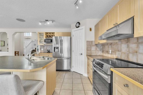 103 Panamount Crescent Nw, Calgary, AB - Indoor Photo Showing Kitchen With Double Sink