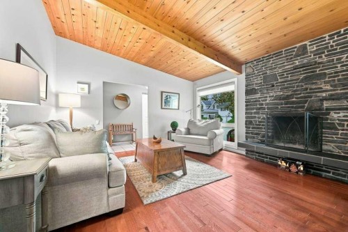 6 Varcourt Place Nw, Calgary, AB - Indoor Photo Showing Living Room With Fireplace