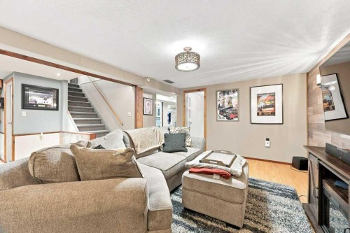6 Varcourt Place Nw, Calgary, AB - Indoor Photo Showing Living Room With Fireplace