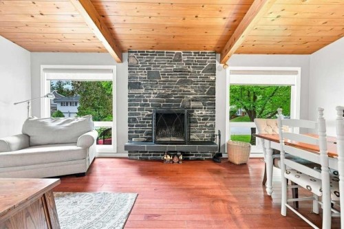 6 Varcourt Place Nw, Calgary, AB - Indoor Photo Showing Living Room With Fireplace
