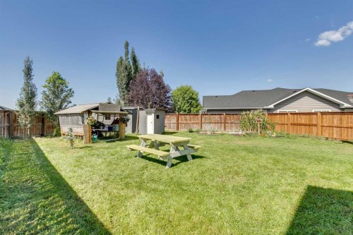 43 Sunrise Crescent Ne, High River, AB - Outdoor With Backyard