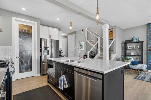 188 Sunrise Common, Cochrane, AB - Indoor Photo Showing Kitchen With Stainless Steel Kitchen With Double Sink With Upgraded Kitchen
