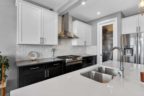 188 Sunrise Common, Cochrane, AB - Indoor Photo Showing Kitchen With Stainless Steel Kitchen With Double Sink With Upgraded Kitchen