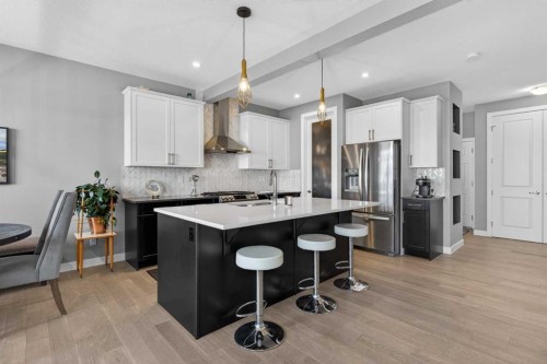 188 Sunrise Common, Cochrane, AB - Indoor Photo Showing Kitchen With Stainless Steel Kitchen With Upgraded Kitchen