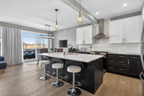 188 Sunrise Common, Cochrane, AB - Indoor Photo Showing Kitchen With Upgraded Kitchen