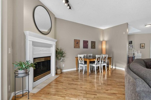 42 Hamptons Link Nw, Calgary, AB - Indoor Photo Showing Other Room With Fireplace
