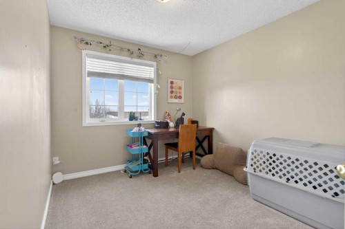 42 Hamptons Link Nw, Calgary, AB - Indoor Photo Showing Bedroom