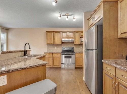 60 Sherwood Way Nw, Calgary, AB - Indoor Photo Showing Kitchen With Double Sink