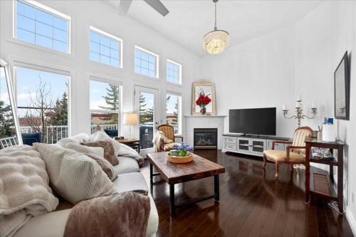 3 Tucker Circle, Okotoks, AB - Indoor Photo Showing Living Room With Fireplace