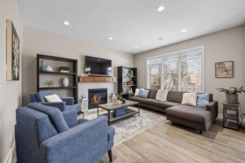 202 Royal Oak Heath Nw, Calgary, AB - Indoor Photo Showing Living Room With Fireplace