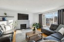 14 Glenhill Crescent, Cochrane, AB  - Indoor Photo Showing Living Room With Fireplace 