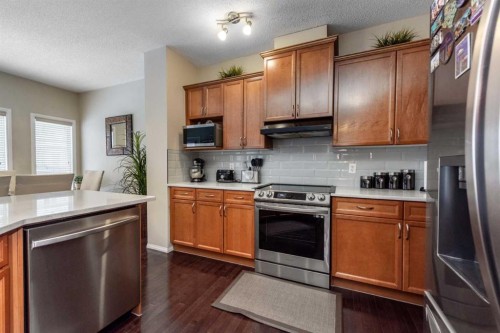 212 Silverado Range Heights Sw, Calgary, AB - Indoor Photo Showing Kitchen With Stainless Steel Kitchen