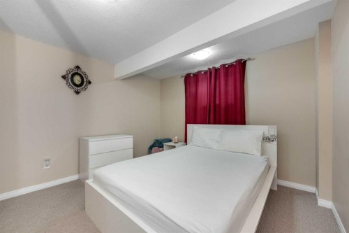 212 Silverado Range Heights Sw, Calgary, AB - Indoor Photo Showing Bedroom
