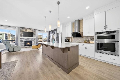 13 Cranbrook Close Se, Calgary, AB - Indoor Photo Showing Kitchen With Fireplace With Upgraded Kitchen