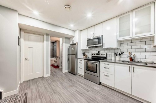 366 Auburn Bay Avenue Se, Calgary, AB - Indoor Photo Showing Kitchen With Double Sink