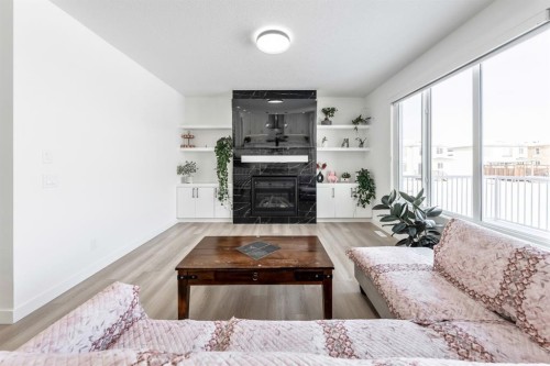 27 Bridges Drive, Langdon, AB - Indoor Photo Showing Living Room With Fireplace