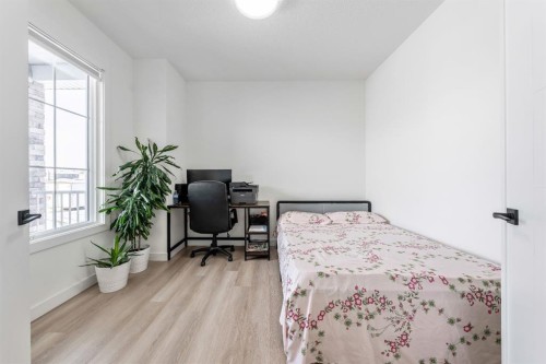 27 Bridges Drive, Langdon, AB - Indoor Photo Showing Bedroom
