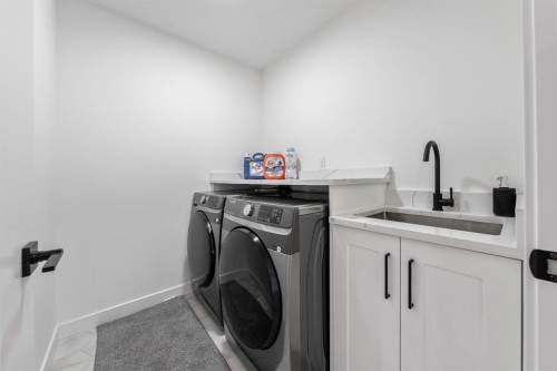 27 Bridges Drive, Langdon, AB - Indoor Photo Showing Laundry Room