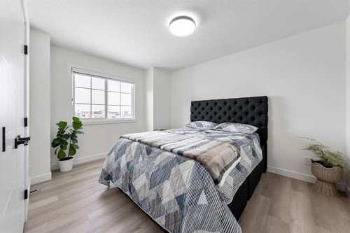 27 Bridges Drive, Langdon, AB - Indoor Photo Showing Bedroom