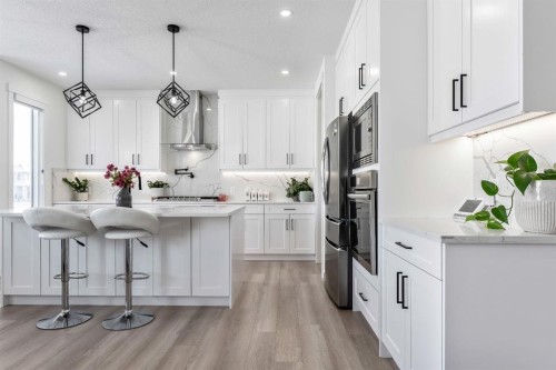27 Bridges Drive, Langdon, AB - Indoor Photo Showing Kitchen With Stainless Steel Kitchen With Upgraded Kitchen