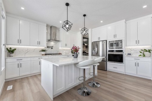 27 Bridges Drive, Langdon, AB - Indoor Photo Showing Kitchen With Stainless Steel Kitchen With Upgraded Kitchen