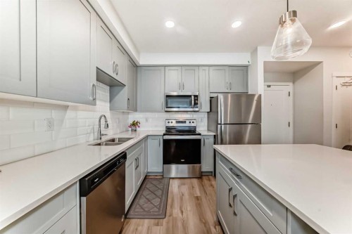 316-200 Shawnee Square Sw, Calgary, AB - Indoor Photo Showing Kitchen With Stainless Steel Kitchen With Double Sink With Upgraded Kitchen