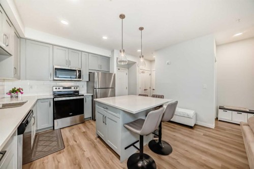 316-200 Shawnee Square Sw, Calgary, AB - Indoor Photo Showing Kitchen With Stainless Steel Kitchen With Upgraded Kitchen