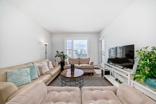 316-200 Shawnee Square Sw, Calgary, AB - Indoor Photo Showing Living Room