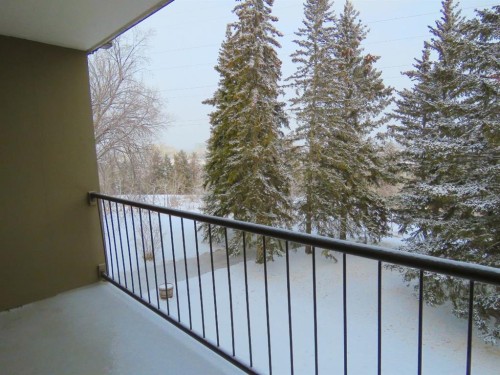 204-328 Cedar Crescent Sw, Calgary, AB - Outdoor With Balcony With Exterior