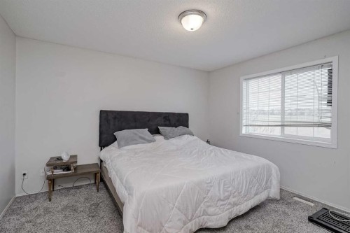 222 Bridleridge Way Sw, Calgary, AB - Indoor Photo Showing Bedroom