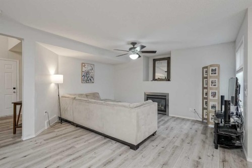222 Bridleridge Way Sw, Calgary, AB - Indoor With Fireplace