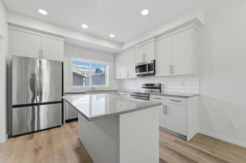 8 Heartwood Lane Se, Calgary, AB - Indoor Photo Showing Kitchen With Upgraded Kitchen