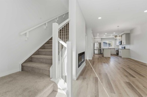 8 Heartwood Lane Se, Calgary, AB - Indoor With Fireplace