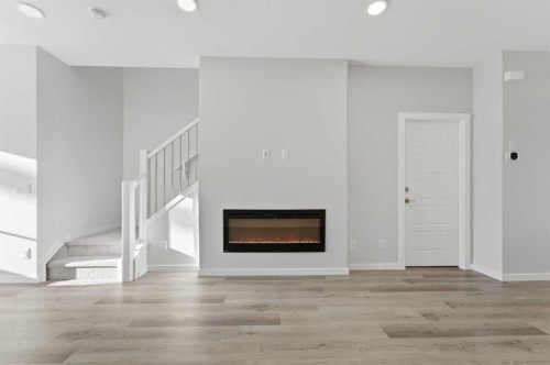 8 Heartwood Lane Se, Calgary, AB - Indoor Photo Showing Living Room With Fireplace