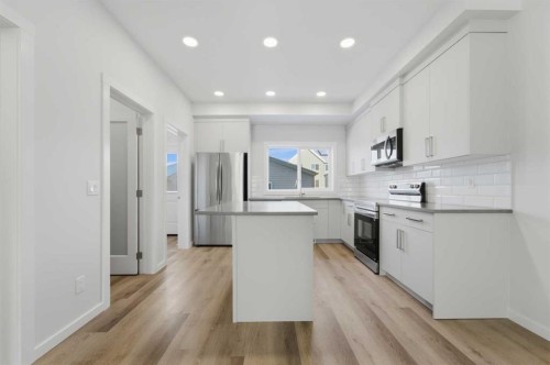 8 Heartwood Lane Se, Calgary, AB - Indoor Photo Showing Kitchen With Upgraded Kitchen