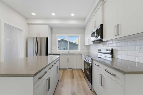 8 Heartwood Lane Se, Calgary, AB - Indoor Photo Showing Kitchen With Upgraded Kitchen