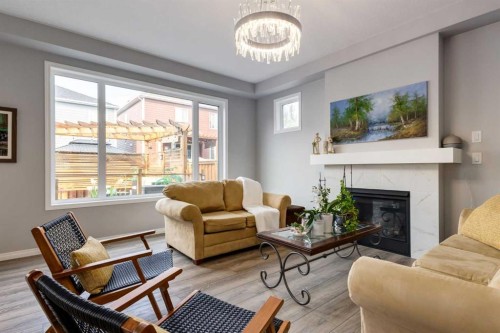 68 Yorkstone Grove Sw, Calgary, AB - Indoor Photo Showing Living Room With Fireplace