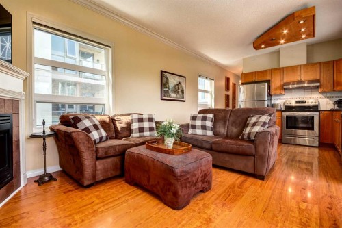 459-333 Riverfront Avenue Se, Calgary, AB - Indoor Photo Showing Living Room With Fireplace