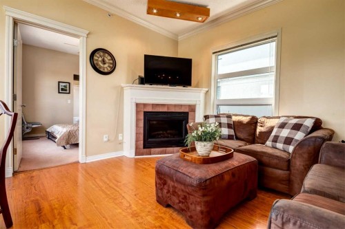 459-333 Riverfront Avenue Se, Calgary, AB - Indoor Photo Showing Living Room With Fireplace