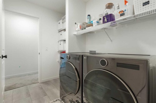 36 Magnolia Bay Se, Calgary, AB - Indoor Photo Showing Laundry Room