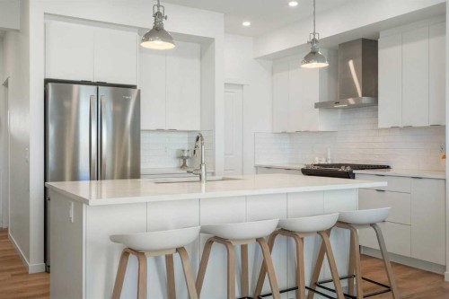 36 Magnolia Bay Se, Calgary, AB - Indoor Photo Showing Kitchen With Upgraded Kitchen