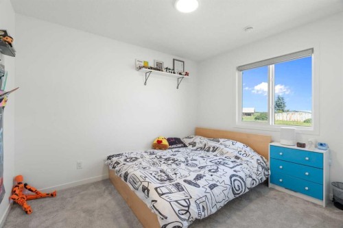 36 Magnolia Bay Se, Calgary, AB - Indoor Photo Showing Bedroom