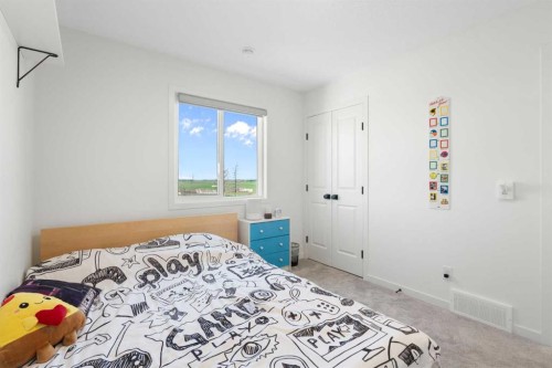 36 Magnolia Bay Se, Calgary, AB - Indoor Photo Showing Bedroom