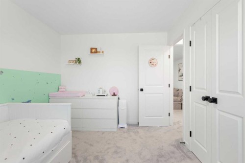 36 Magnolia Bay Se, Calgary, AB - Indoor Photo Showing Bedroom