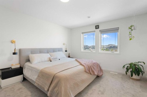 36 Magnolia Bay Se, Calgary, AB - Indoor Photo Showing Bedroom